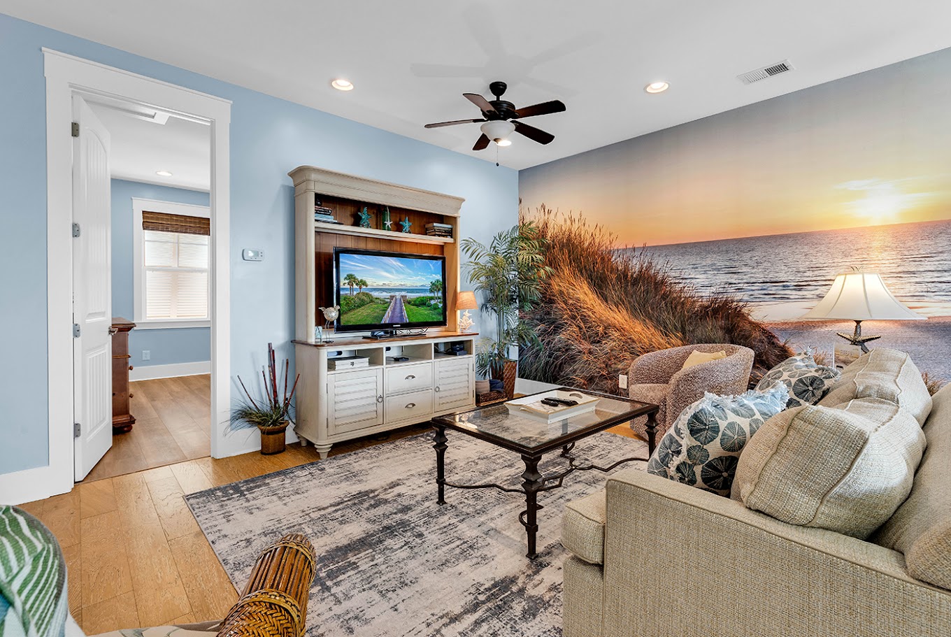 Living room with entertainment center and mural